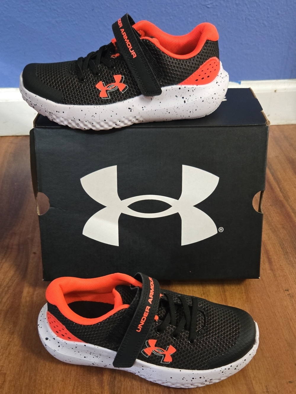 Under Armour Kids Black and Orange Athletic Sneakers with White Speckled Sole 1y